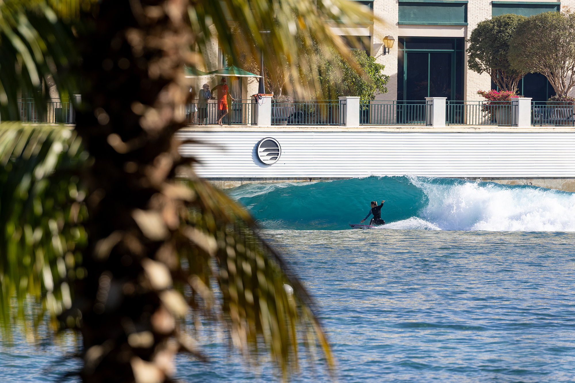 Molly Picklum bottom turns at PerfectSwell Boa Vista Village